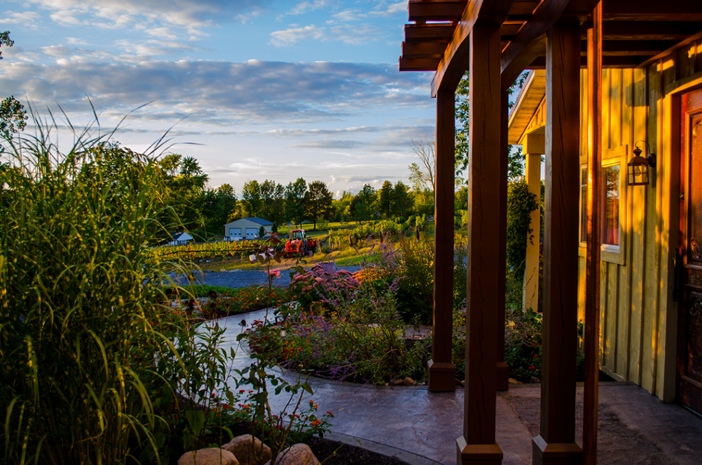 View from the Heart & Hands Winery Tasting room garden at sunset after one of the best finger lakes winery tasting experiences.